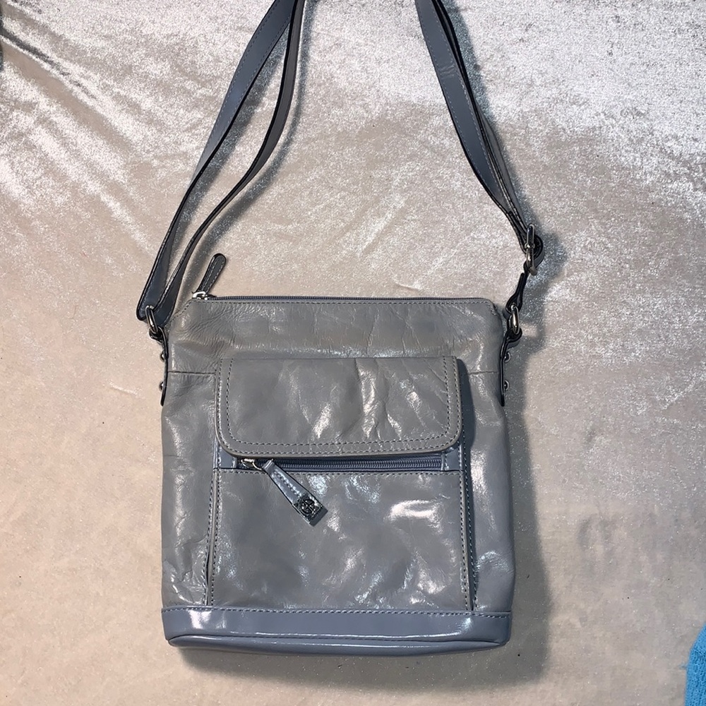 Light blue leather purse with synthetic details